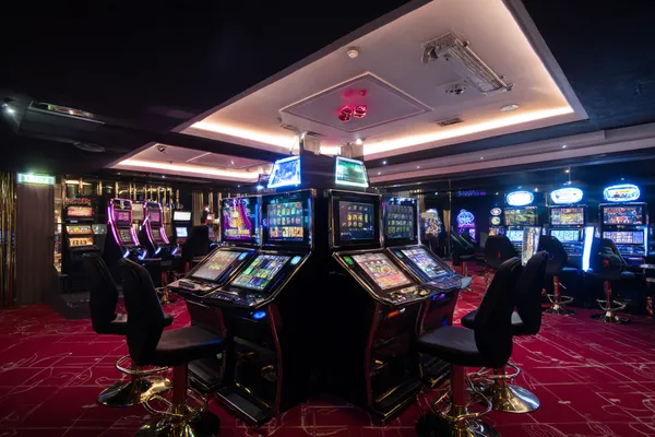 A person using their device against a moody casino-themed background, illustrating the smooth re-entry process at FONBED.
